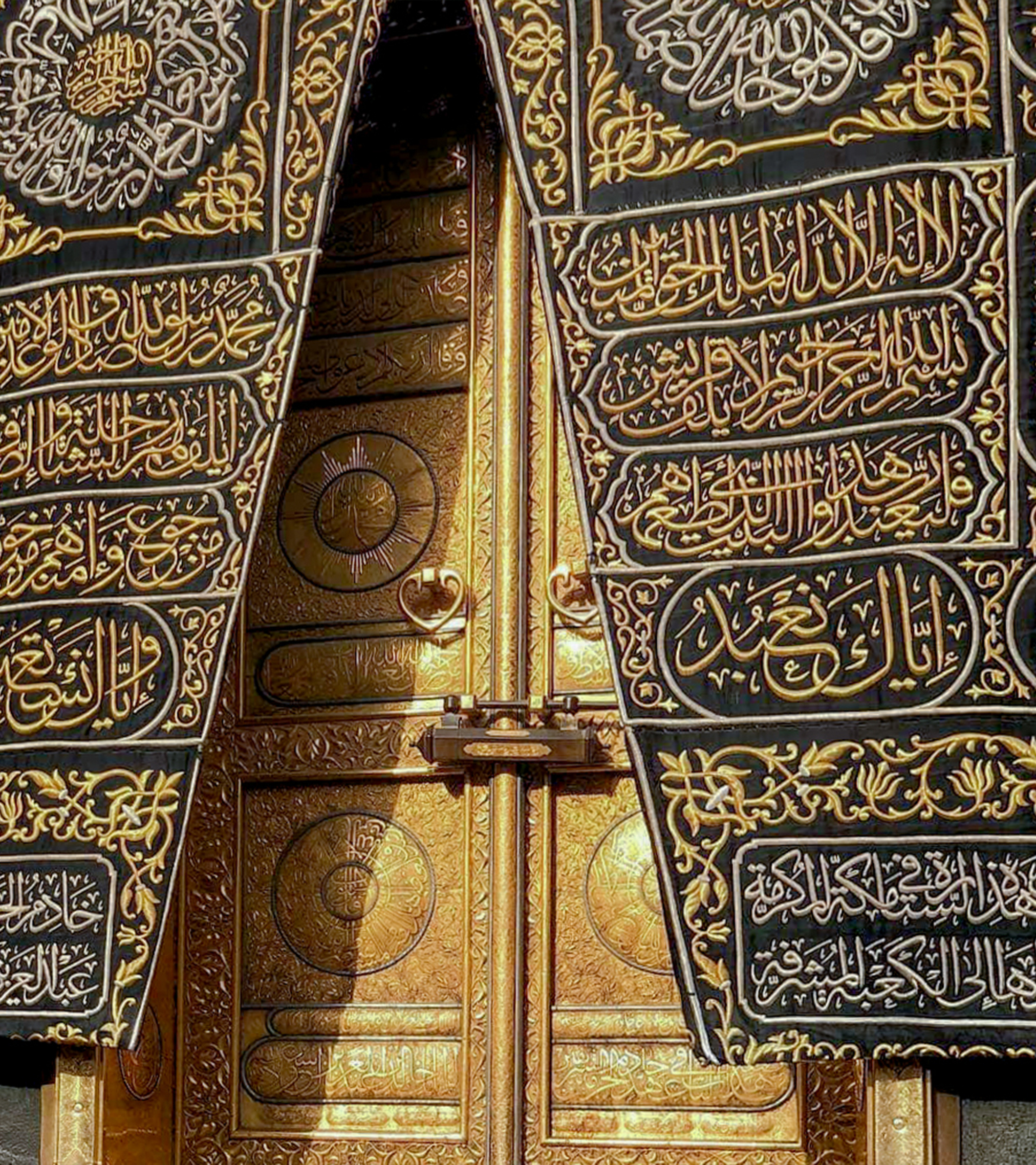 The door of the Kaaba called Multazam at Grant holy mosque Al-Haram in Mecca Saudi Arabia. Muslim Pilgrims at The Kaaba in The Great Mosque of Mecca.